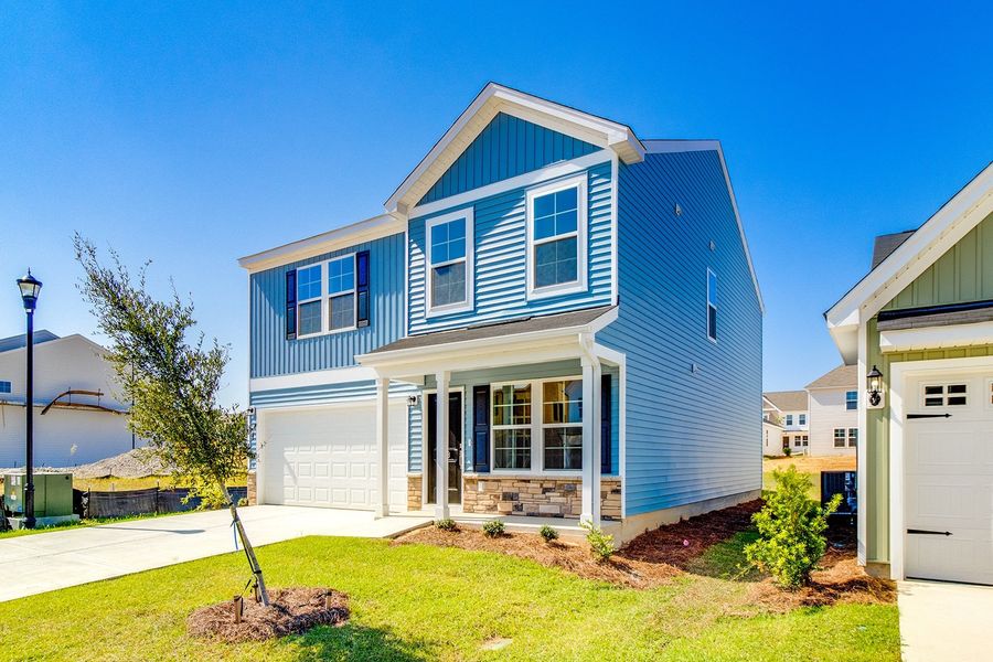 Front exterior of a new home in Winston Point, Gilbert, SC, highlighting curb appeal (Image 2).