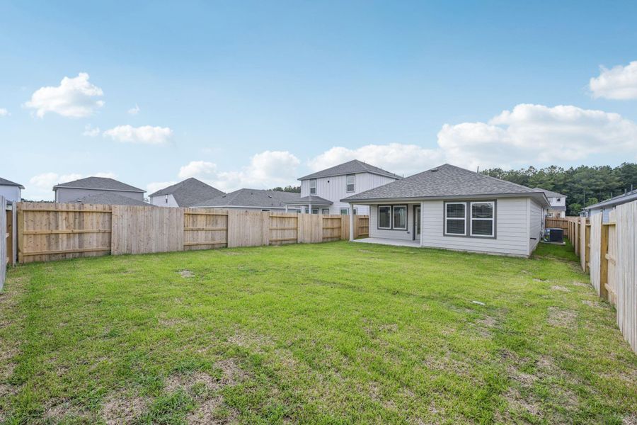 Front exterior of a new home in Landing Meadows - Traditional Series, New Caney, TX, highlighting curb appeal (Image 15). Front exterior of a new home in Landing Meadows - Traditional Series, New Caney, TX, highlighting curb appeal (Image 15).