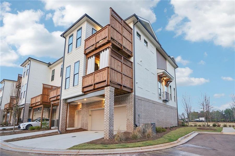 Front exterior of a new home in IveyBrooke, Alpharetta, GA, highlighting curb appeal (Image 24).