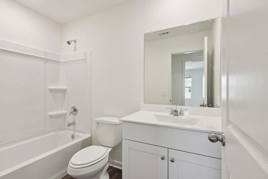 Representative furnished interior of a home built from the Compass by Starlight Homes in The Wilder, Adkins (Image 13).