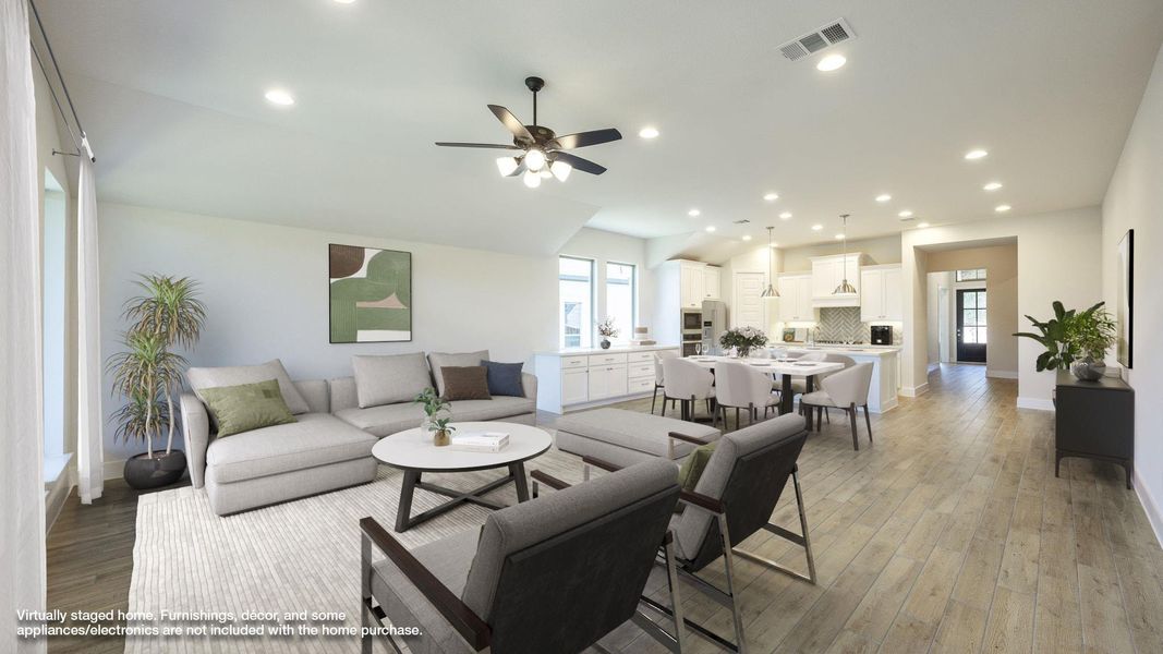 Living area with recessed lighting, light wood finished floors, lofted ceiling, and ceiling fan Living area with recessed lighting, light wood finished floors, lofted ceiling, and ceiling fan