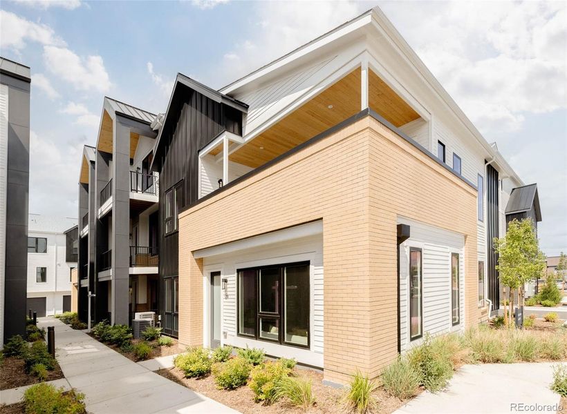 Front exterior of a new home in A Line Townhomes, Denver, CO, highlighting curb appeal (Image 2).