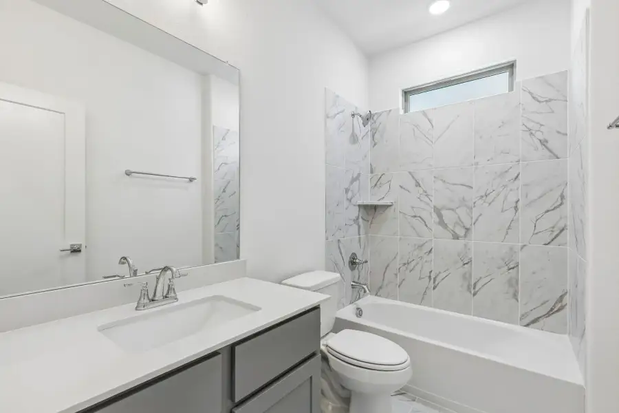 Bathroom in the Claret home plan by Trophy Signature Homes – REPRESENTATIVE PHOTO