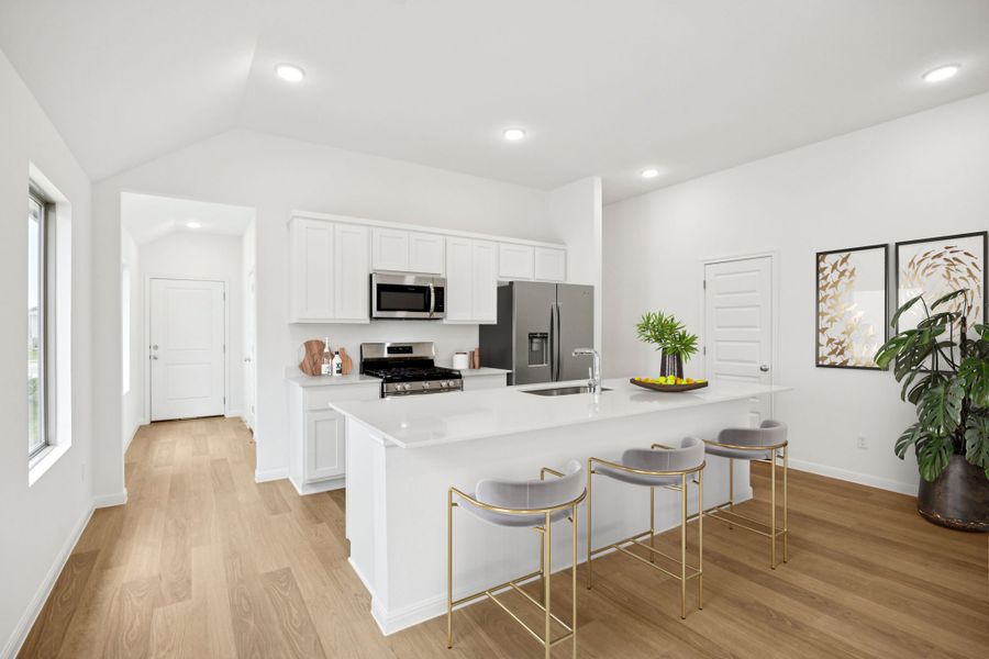 Kitchen in the Spruce home plan by Trophy Signature Homes - REPRESENTATIVE PHOTO