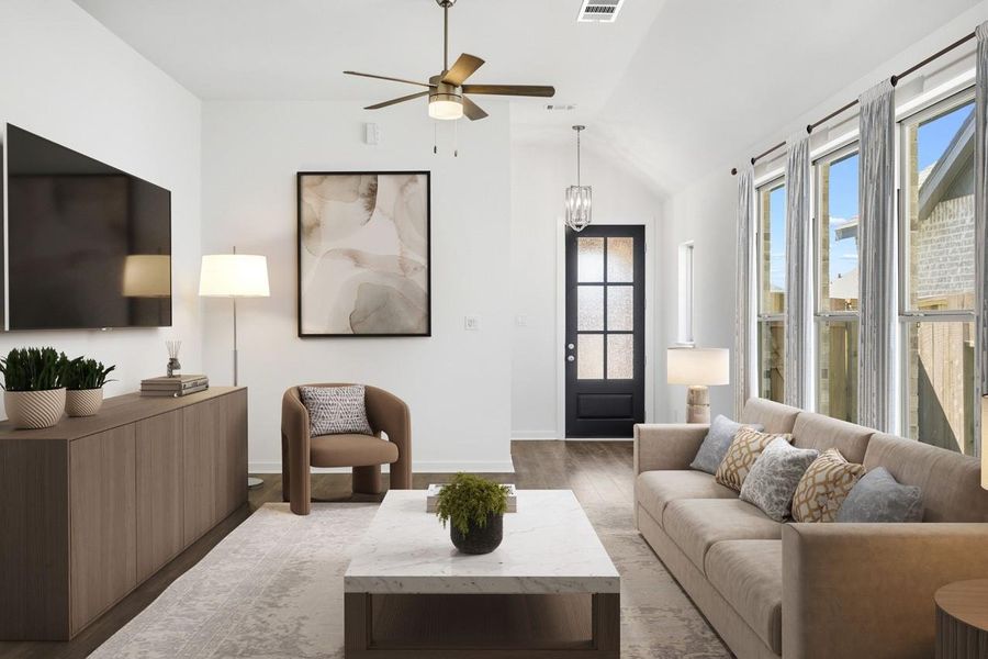 Virtually staged family room looking into the entry. Family room has large windows that bring in tons of natural light. Virtually staged family room looking into the entry. Family room has large windows that bring in tons of natural light.
