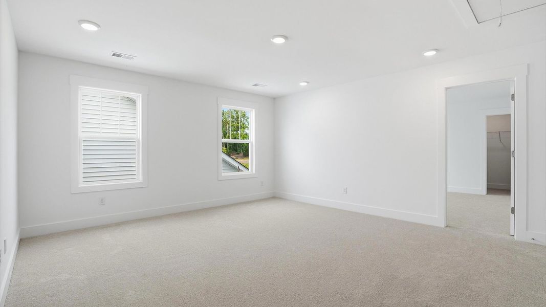 Accomplished upstairs loft with plush carpet and versatile functionality
