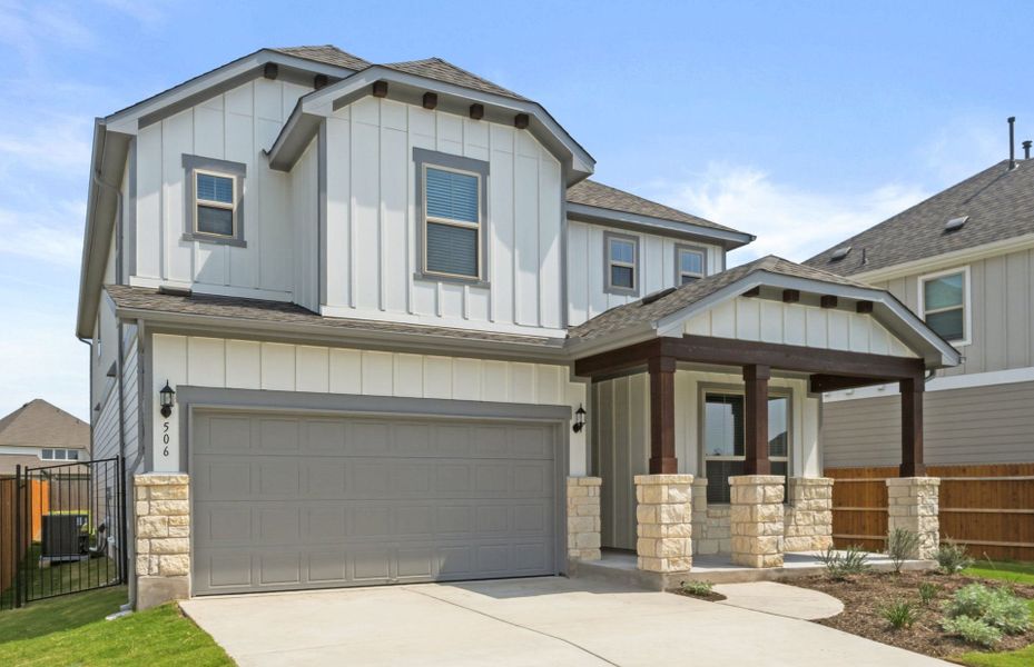 Front exterior of a new home in Santa Rita Ranch, Liberty Hill, TX, highlighting curb appeal (Image 2). Front exterior of a new home in Santa Rita Ranch, Liberty Hill, TX, highlighting curb appeal (Image 2).