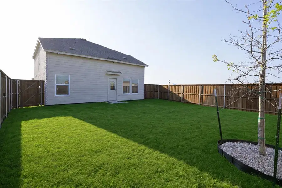 Exterior details and patio area of a home in Creekview, Pilot Point (Image 3).