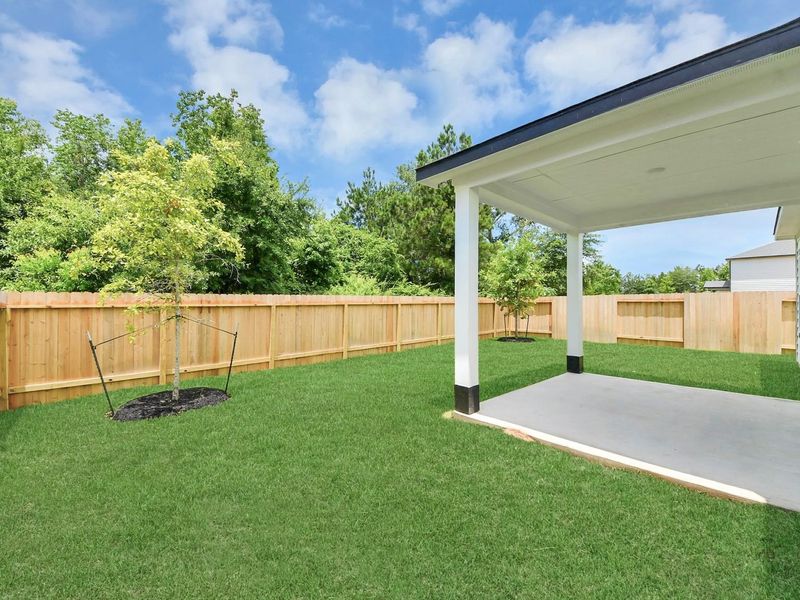 Exterior details and patio area of a home in Caney Creek Place, Conroe (Image 3).