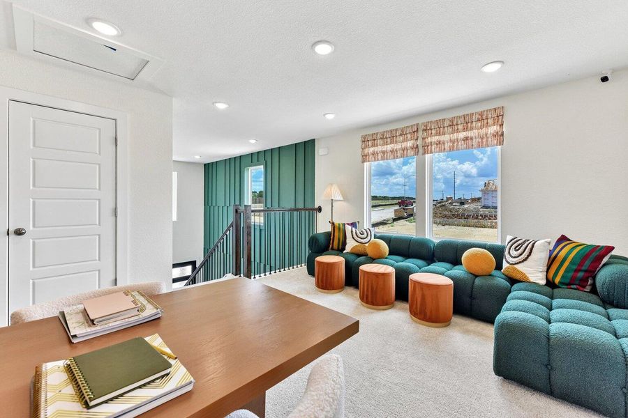 Recessed lighting and soft carpet floor enhance this versatile upper level loft space. Recessed lighting and soft carpet floor enhance this versatile upper level loft space.