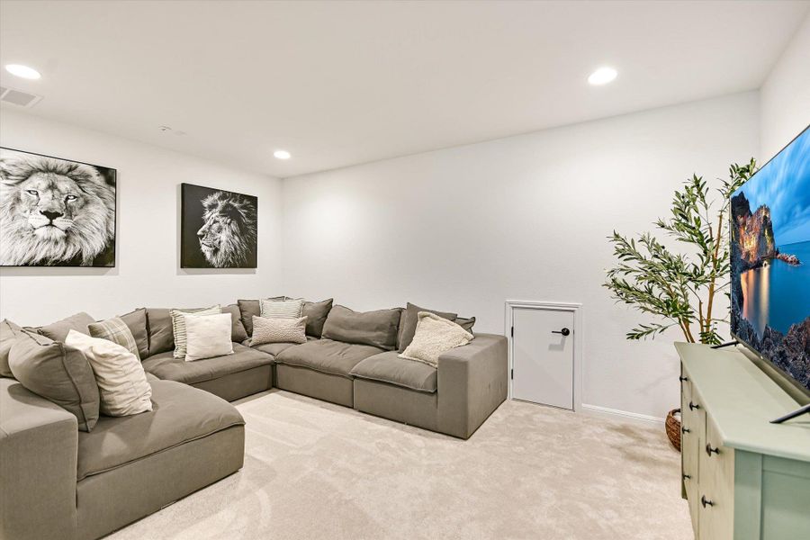 A spacious media room with recessed lighting and upgraded surround sound for Family Movie Night. Bring your own buttered popcorn and candy!