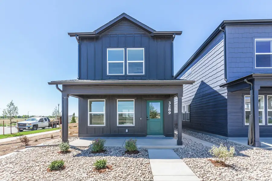 Front exterior of a new home in Bloom, Fort Collins, CO, highlighting curb appeal (Image 2). Front exterior of a new home in Bloom, Fort Collins, CO, highlighting curb appeal (Image 2).