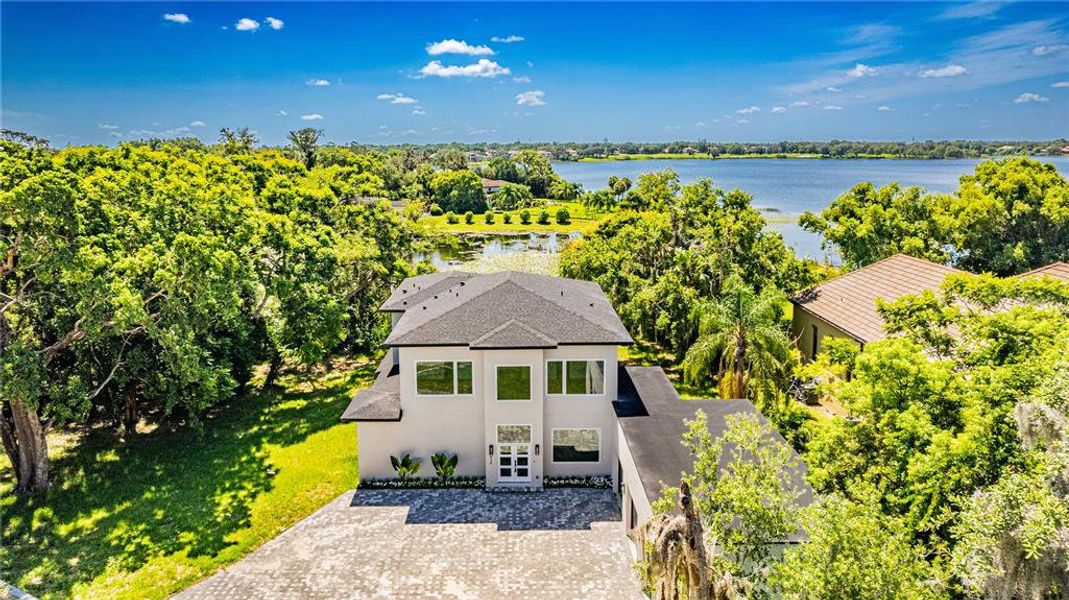 Front exterior of a new home in , Windermere, FL, highlighting curb appeal (Image 20).