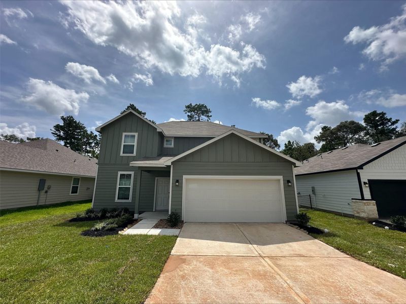 Front exterior of a new home in Lakes at Crockett Martin, Conroe, TX, highlighting curb appeal (Image 18).