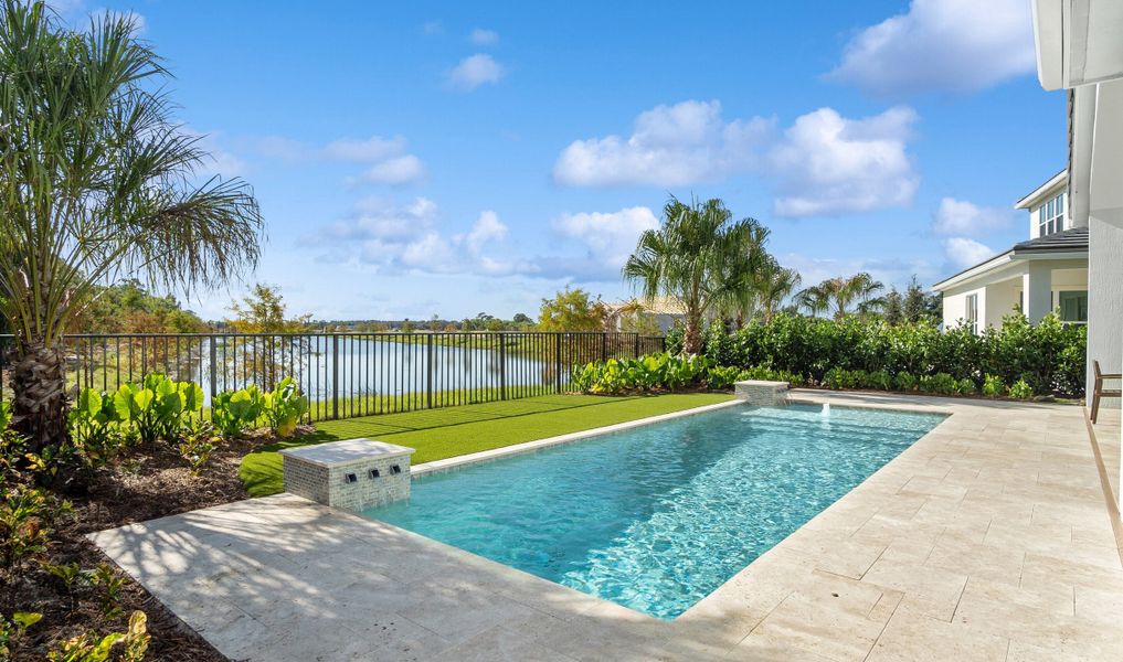 Scenic backyard with in-ground pool