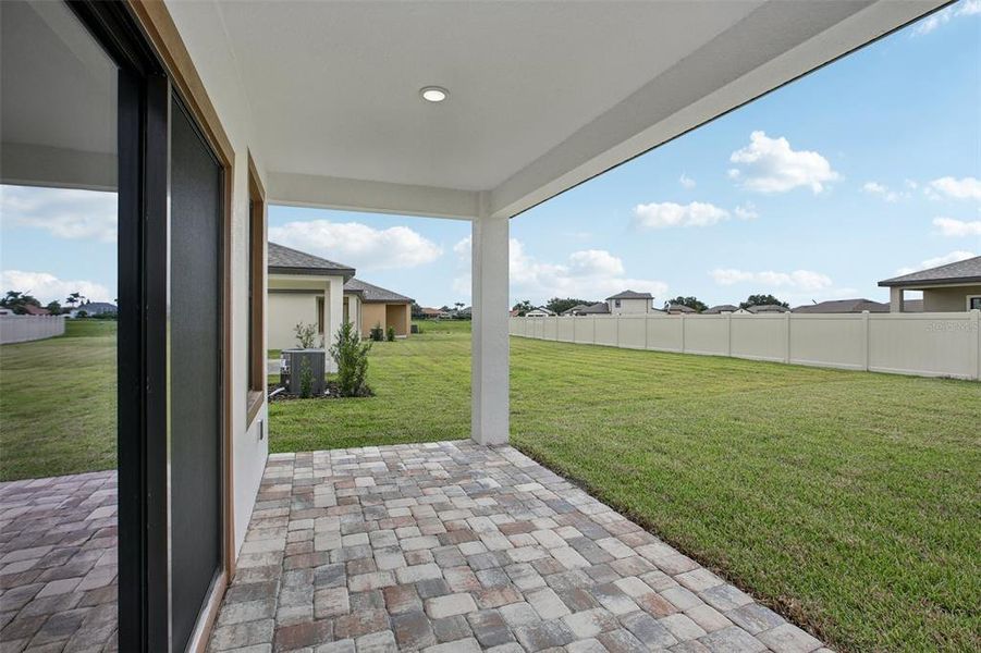 Exterior details and patio area of a home in Grasslands West, Lakeland (Image 4).