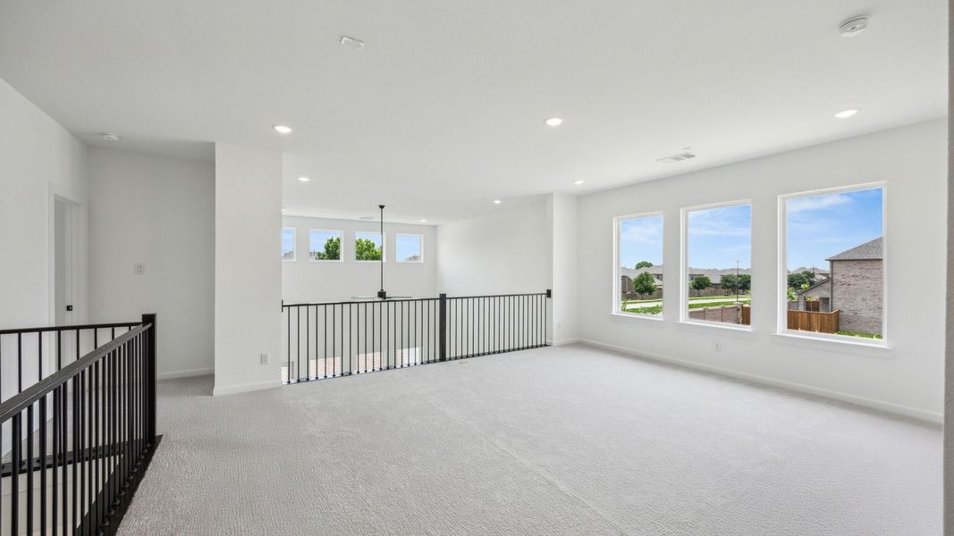 Representative unfurnished interior of a home built from the Royale II by Normandy Homes in Village on Main Street, Frisco (Image 16).