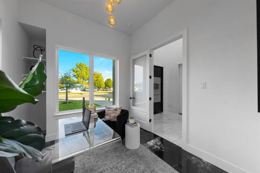 Office near front entry with glass chandelier and built in shelving. Office near front entry with glass chandelier and built in shelving.