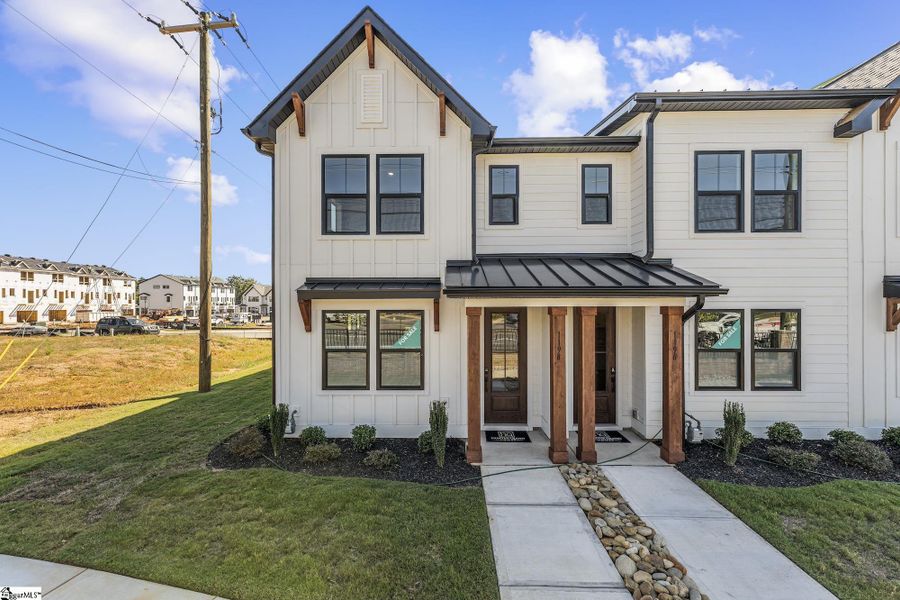 Front exterior of a new home in Renaissance Place, Greenville, SC, highlighting curb appeal (Image 1).