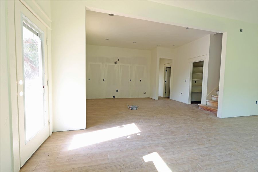 Dining area with view of kitchen and stairs to upper level Dining area with view of kitchen and stairs to upper level