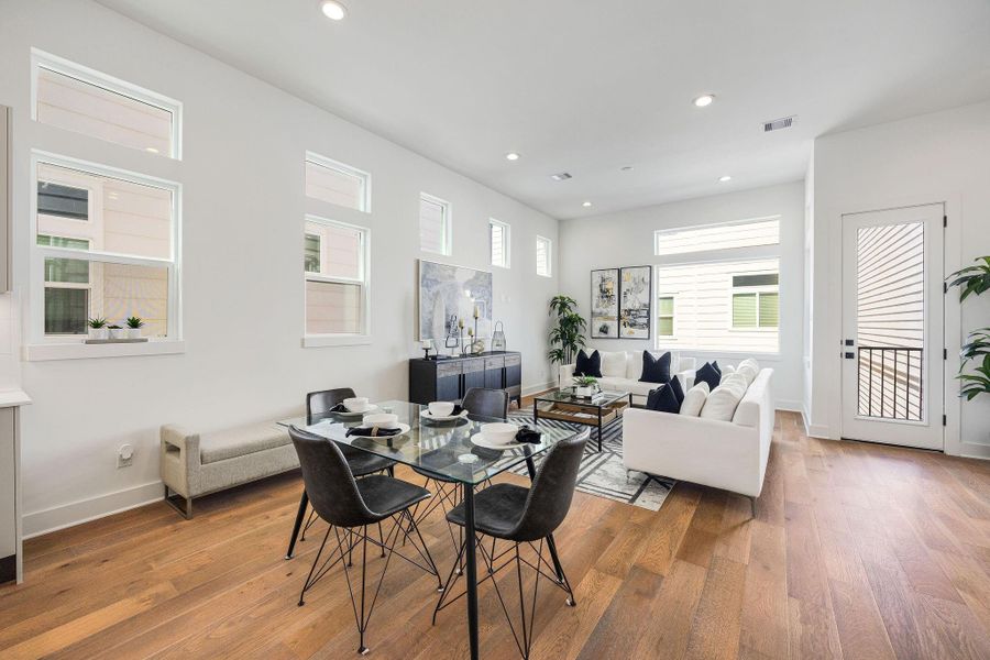 Another view of the dining area seamlessly connected to the living room and balcony perfect for entertaining and family gatherings.