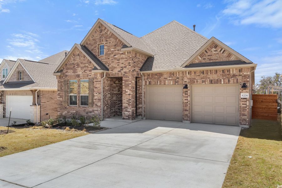 Representative exterior photo of a completed home built from the Sawgrass by Ashton Woods in Berry Creek Highlands, Georgetown, TX (Image 22). Representative exterior photo of a completed home built from the Sawgrass by Ashton Woods in Berry Creek Highlands, Georgetown, TX (Image 22).
