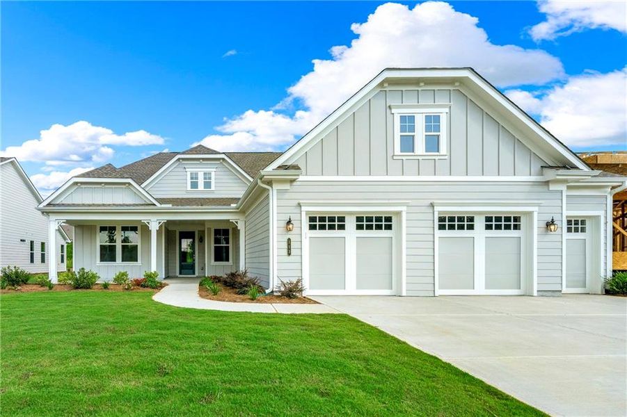 Front exterior of a new home in Cresswind Georgia at Twin Lakes, Hoschton, GA, highlighting curb appeal (Image 24).