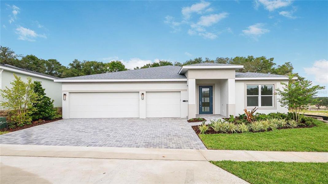 Front exterior of a new home in Cresswind at Hammock Oaks, Lady Lake, FL, highlighting curb appeal (Image 2). Front exterior of a new home in Cresswind at Hammock Oaks, Lady Lake, FL, highlighting curb appeal (Image 2).