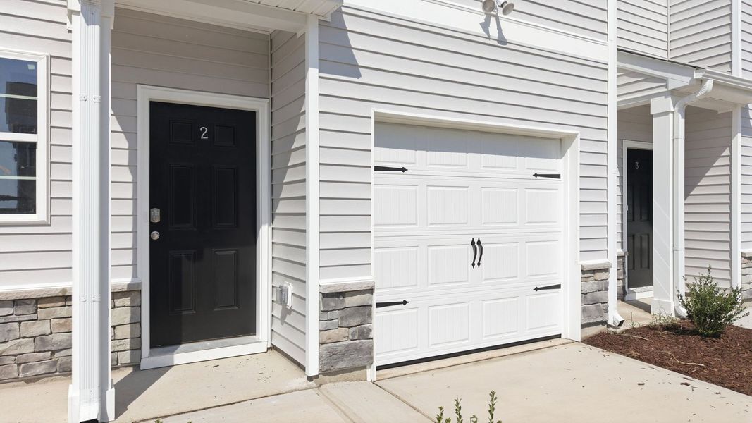 Exterior details and patio area of a home in The Townes at Ridgewood Farms, Winterville (Image 3).