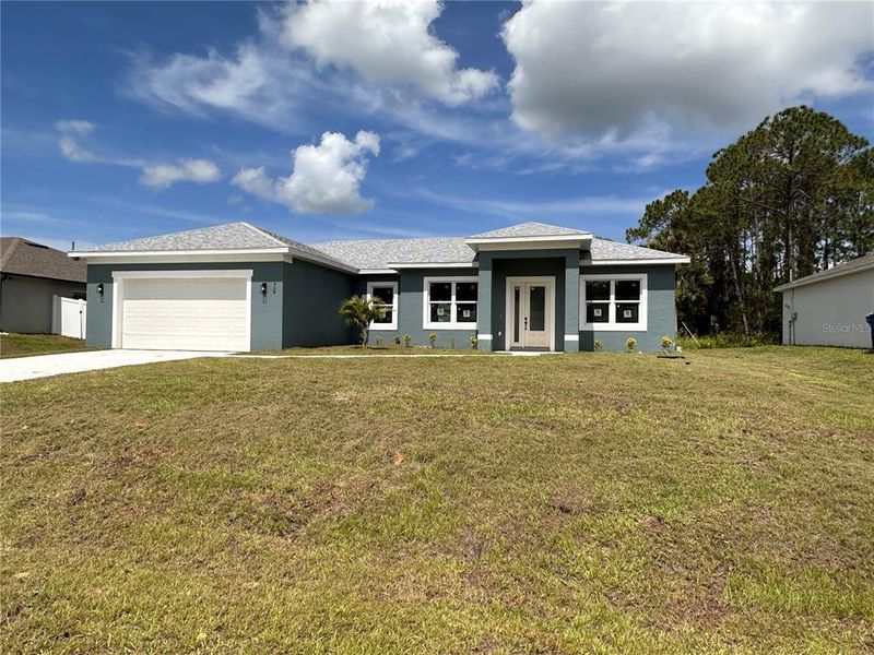 Front exterior of a new home in , Palm Bay, FL, highlighting curb appeal (Image 25). Front exterior of a new home in , Palm Bay, FL, highlighting curb appeal (Image 25).