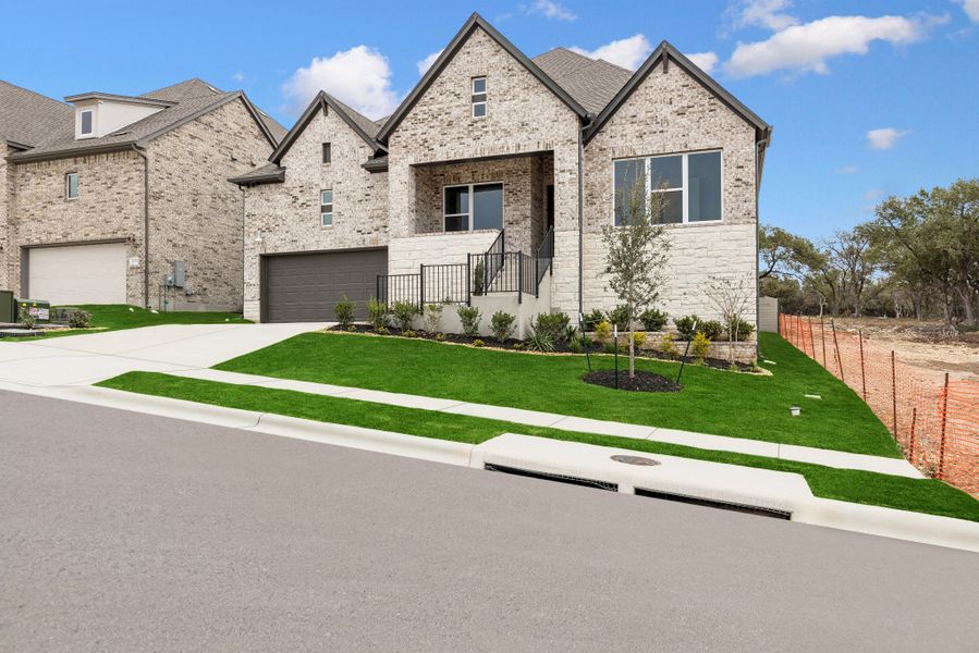 Front exterior of a new home in Wolf Ranch – West Bend, Georgetown, TX, highlighting curb appeal (Image 2).