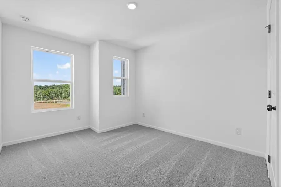 Spacious, unfurnished interior of a new home in Weatherfield, Buford (Image 21).