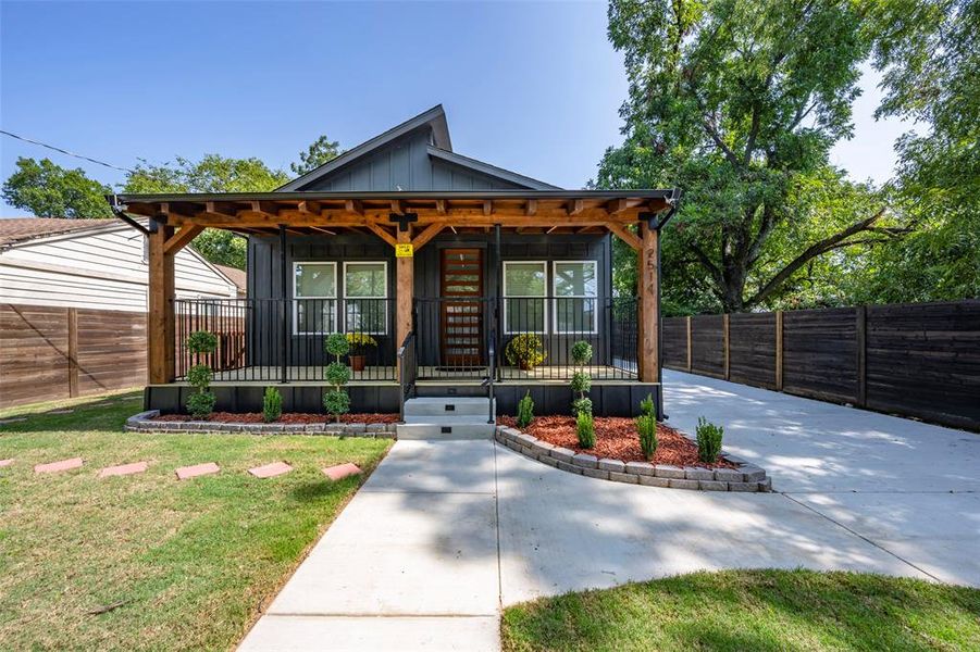 View of front of property featuring board and batten siding and a porch