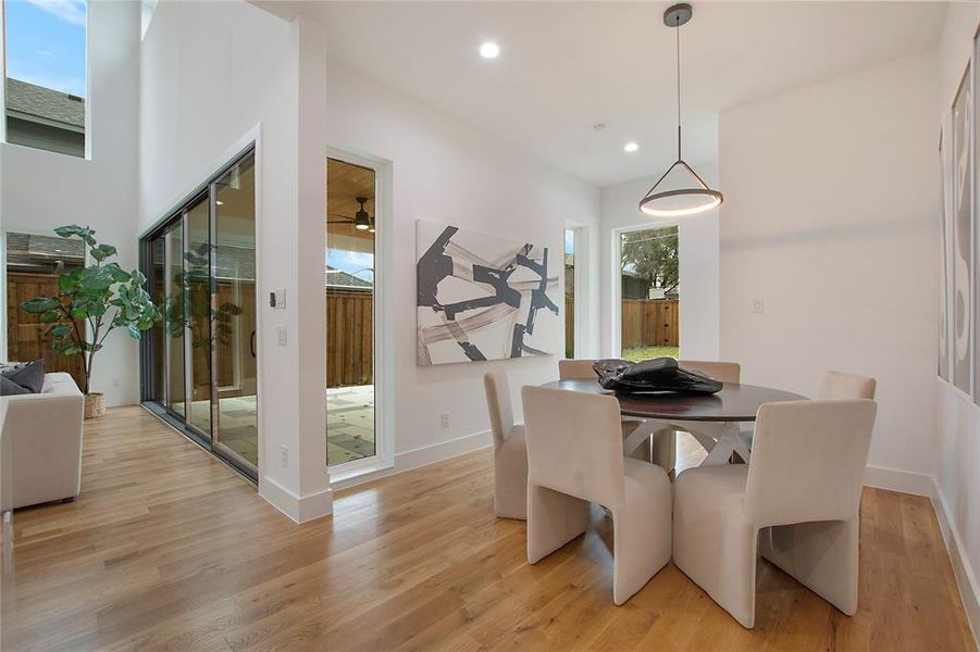 Dining room featuring ceiling fan and light hardwood / wood-style flooring