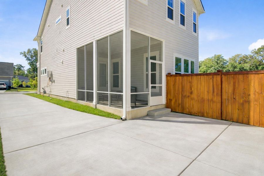 Exterior details and patio area of a home in Limehouse Village: Row Collection, Summerville (Image 26).