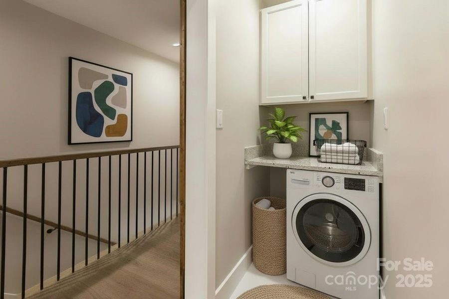 Convenient laundry area located between both primary suites.