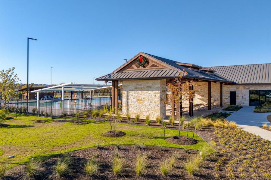 The central community center acts as the neighborhood hub, surrounded by open spaces and walkways The central community center acts as the neighborhood hub, surrounded by open spaces and walkways