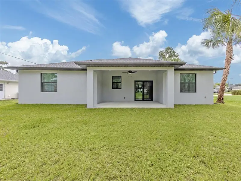 Exterior details and patio area of a home in , North Port (Image 25).