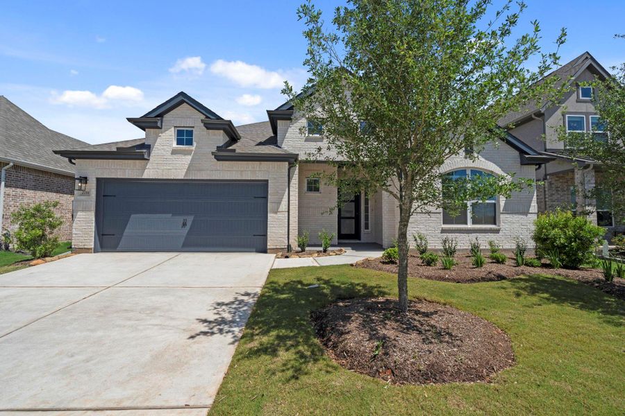 Front exterior of a new home in Jordan Ranch, Fulshear, TX, highlighting curb appeal (Image 20).