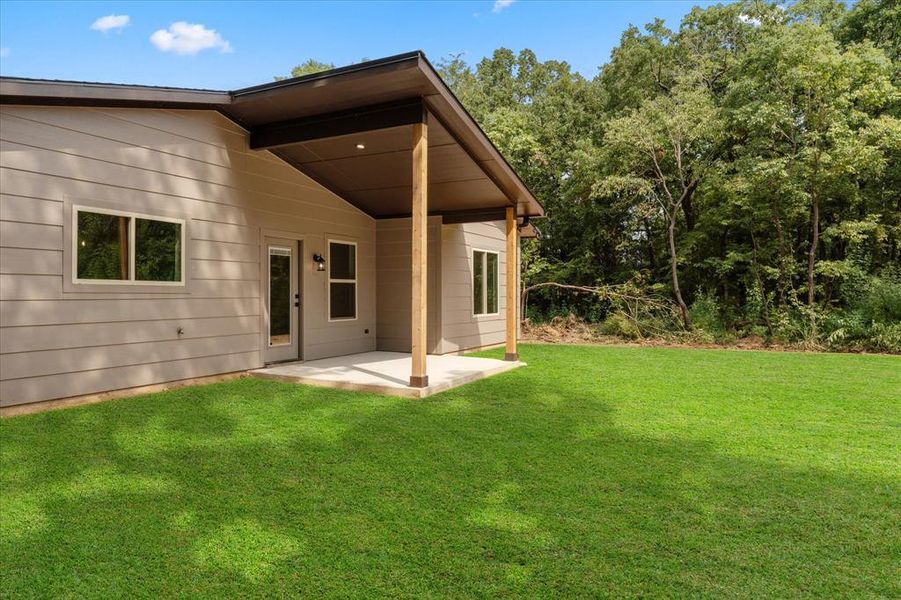 Front exterior of a new home in , Gun Barrel City, TX, highlighting curb appeal (Image 2). Front exterior of a new home in , Gun Barrel City, TX, highlighting curb appeal (Image 2).