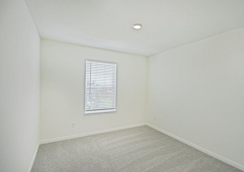 Secondary bedroom with faux wood window blinds