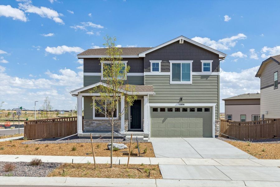 Front exterior of a new home in Windler, Aurora, CO, highlighting curb appeal (Image 1). Front exterior of a new home in Windler, Aurora, CO, highlighting curb appeal (Image 1).