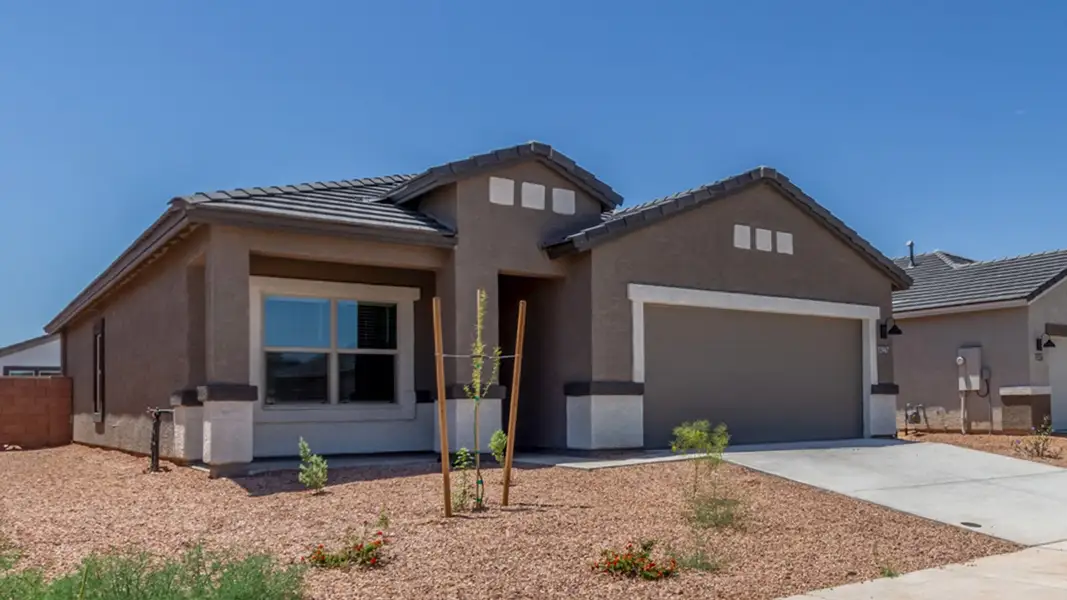 Front exterior of a new home in Barnett Village, Marana, AZ, highlighting curb appeal (Image 2).