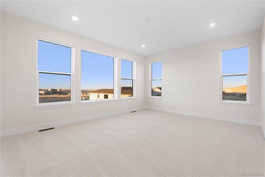 Spacious, unfurnished interior of a new home in Autograph at Lyric, Lone Tree (Image 40).