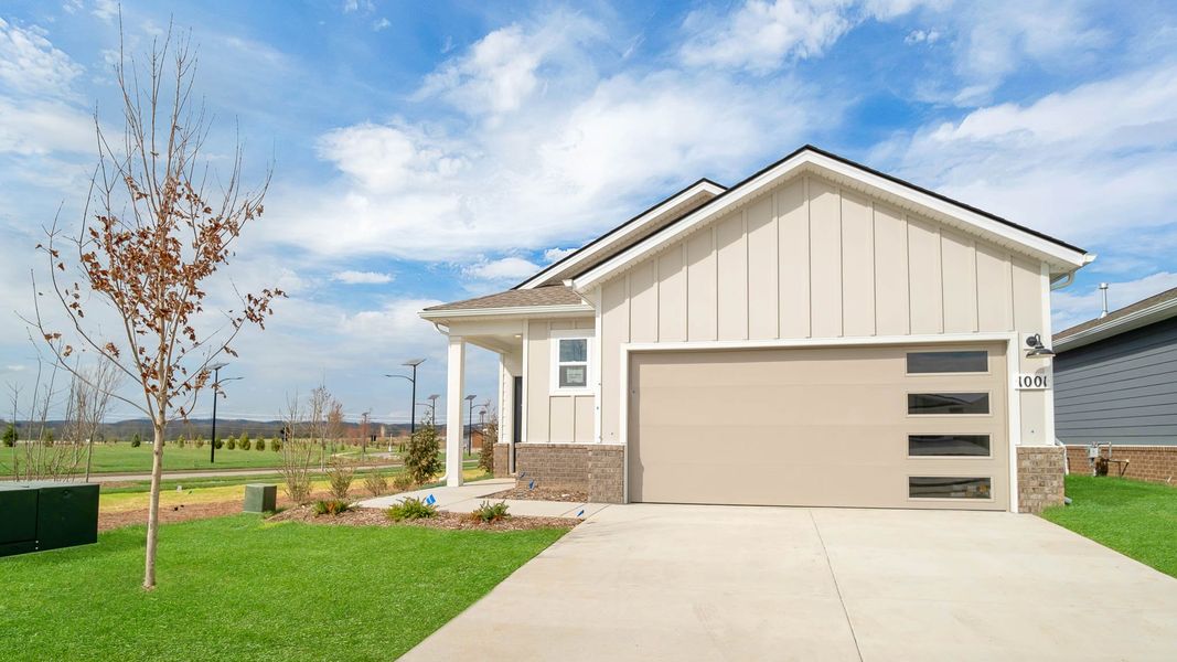Front exterior of a new home in Nexus South, Gallatin, TN, highlighting curb appeal (Image 2). Front exterior of a new home in Nexus South, Gallatin, TN, highlighting curb appeal (Image 2).