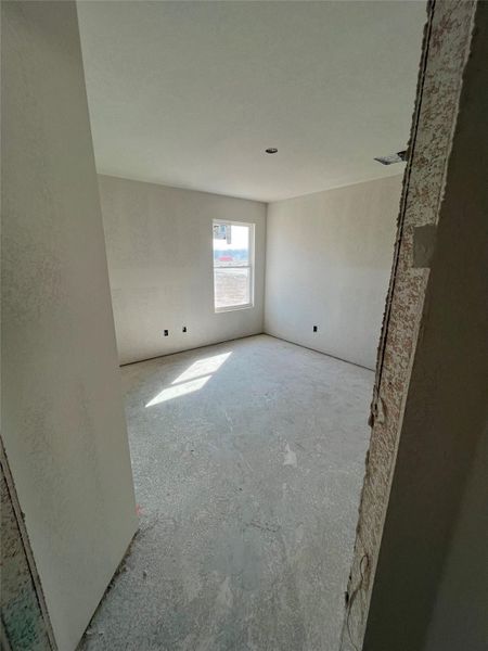 Spare room with concrete flooring