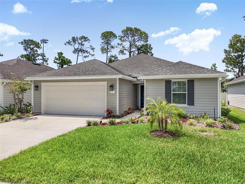 Front exterior of a new home in , Flagler Beach, FL, highlighting curb appeal (Image 26). Front exterior of a new home in , Flagler Beach, FL, highlighting curb appeal (Image 26).