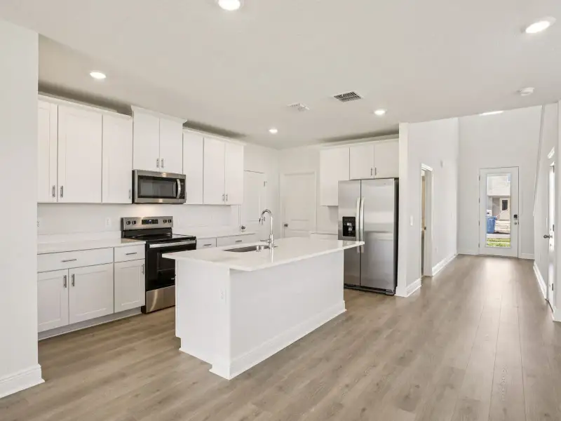 Furnished interior view inside a new home in Villamar - Classic Series, Winter Haven (Image 3).