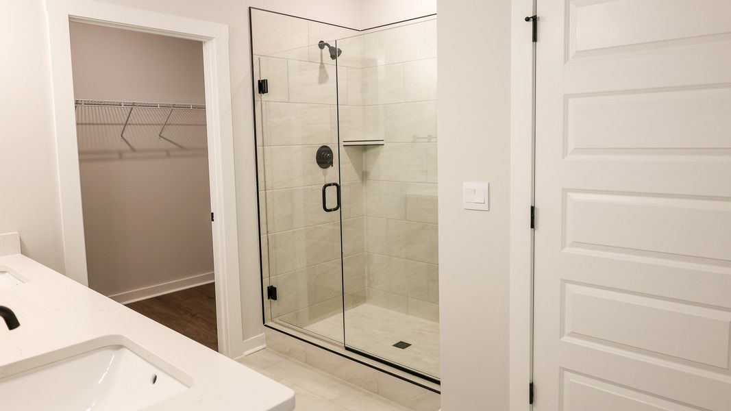 Representative furnished interior of a home built from the STONEBROOK II by D.R. Horton in Harvest Point, Spring Hill (Image 13).