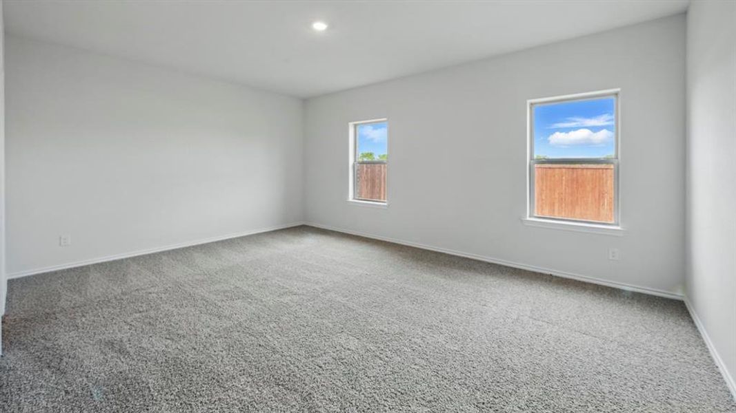 Unfurnished room with carpet floors and recessed lighting